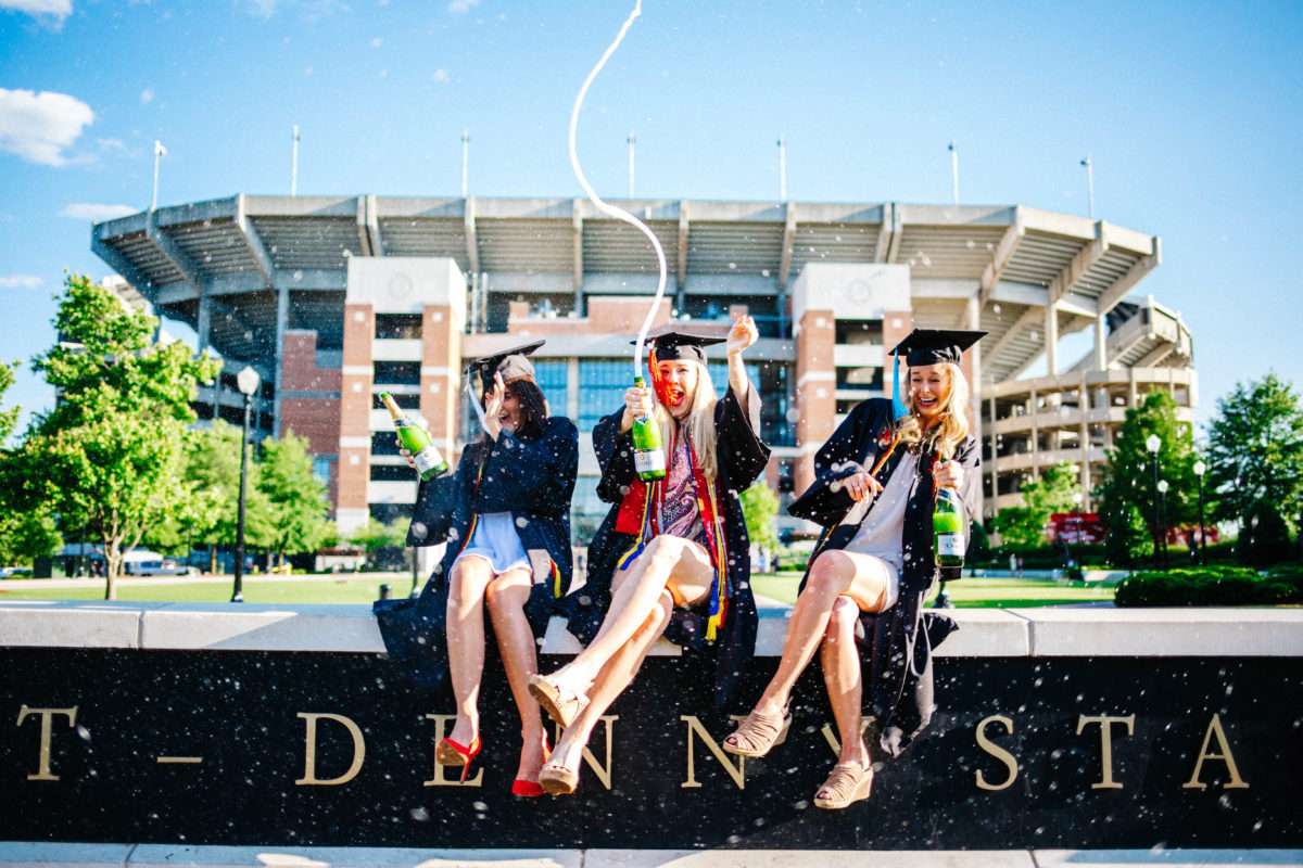 Three Millennial girls celebrating after graduation